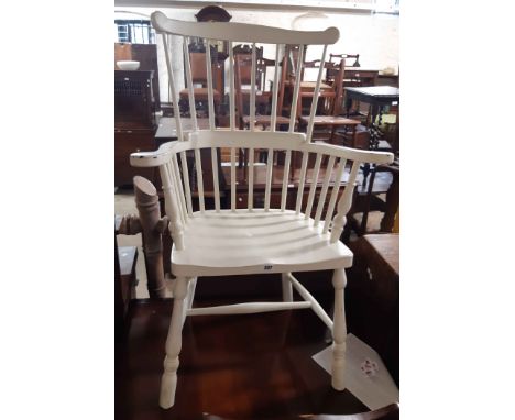 A 20th Century painted wood high stick back Windsor style elbow chair with solid moulded seat, set on turned supports