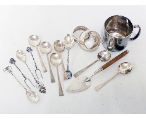 A set of six silver coffee spoons, personalised christening mug, trowel and two napkin rings, etc.