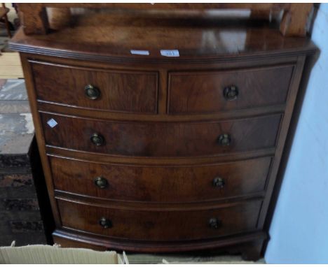 A 69cm reproduction mahogany and crossbanded bow front chest of two short and three long graduated drawers, set on bracket fe