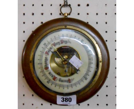 A reproduction polished wood cased sedan style wall barometer with visible aneroid works to dial centre