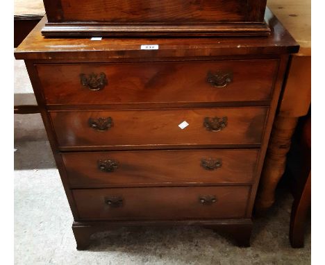 A 63cm reproduction mahogany and crossbanded chest of four long graduated drawers, set on bracket feet