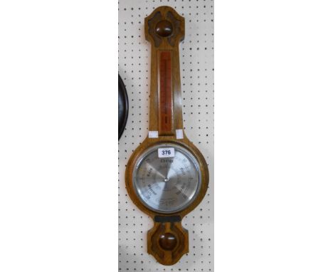 A 20th Century Comitti of London polished oak cased banjo barometer/thermometer with aneroid works and bearing presentation p