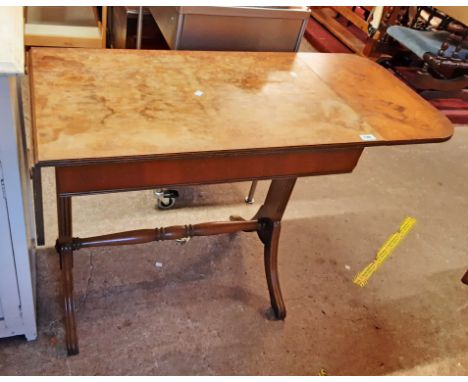 An 82cm reproduction walnut and cross banded sofa table, set on moulded standard ends - for repolishing