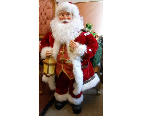 A large Bradford Exchange Thomas Kincade Masterpiece Santa Claus with recording of The Night Before Christmas and light up la