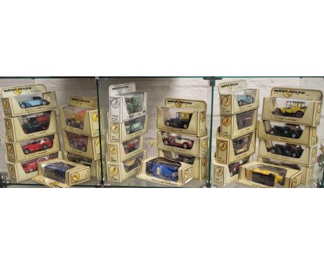 Twenty-five Matchbox Models of Yesteryear in cream window boxes including BP and Dunlop. (25)