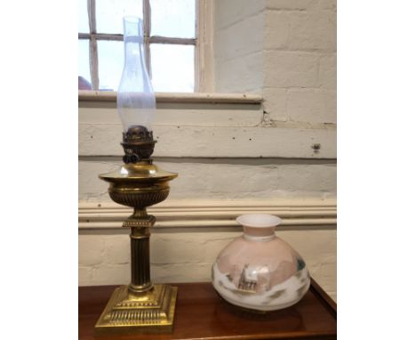 A brass oil lamp with a hand painted shade 68cm