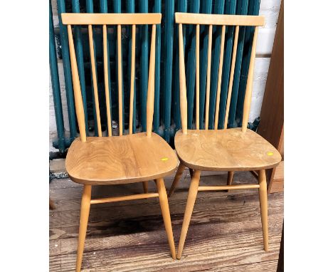 A pair of blonde Ercol stickback chairs, 93cm (2)