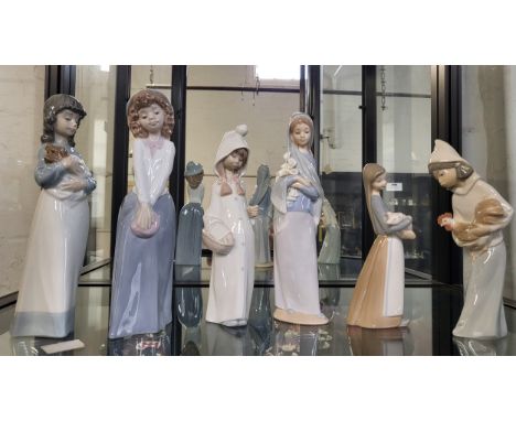 Four Lladro girl figures 17cm to 24cm, and two Nao girl figures 24cm. (6)