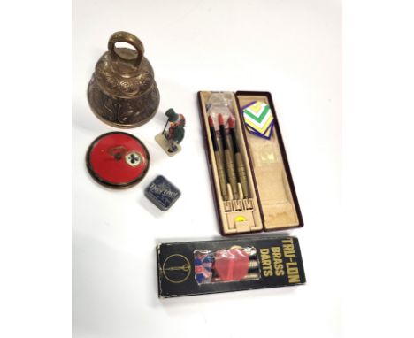 A brass bell 10cm x 9cm, metal case bridge counter 7cm wide, mini metal box game, mini metal Scrooge model 6cm, and two cases
