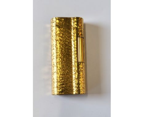 A Dunhill gold plated 'bark effect' lighter.