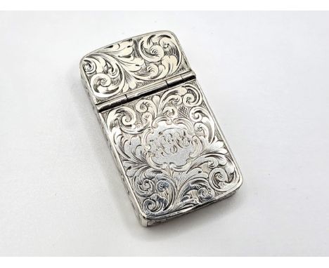 A silver monogrammed snuff box with a hinged double sided lid and completely covered in an ornate foliate design, Ralph Samue