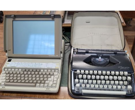 A vintage Olympia Splendid 99 portable typewriter in original zip-up case and a Delta General One laptop computer. (2)