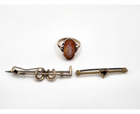 A 9ct yellow gold hardstone cameo ring with a seed pearl set either side 3.2gms size N and a 9ct yellow gold fox's head pin 1