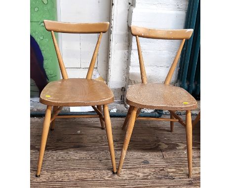 A pair of Ercol stacking chairs, 75cm. (2)