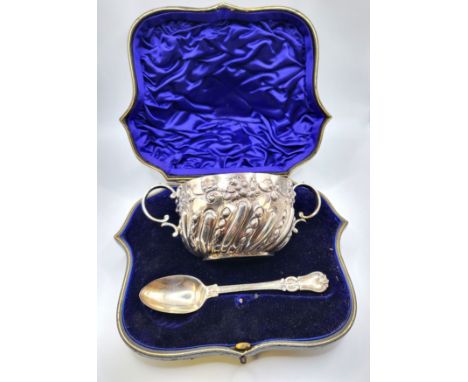 A silver two-handled bowl decorated with fruit, William Hutton &amp; Sons Ltd, London  1889 in original box with a silver spo