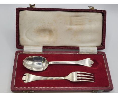 A boxed christening set of a spoon and fork Sheffield 1966 with rat tail ends design.
