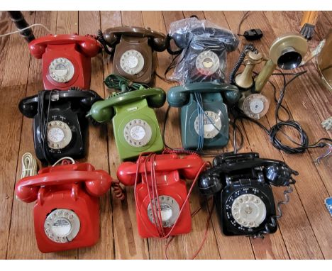 Nine retro dial telephones in black, brown, dark green, two-tone green, and red, and a reproduction candlestick telephone, al