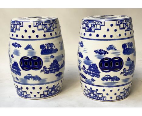 CHINESE GARDEN STOOLS, a pair, blue and white Chinese ceramic of pierced barrel form, 46cm H x 33cm diam. (2) 