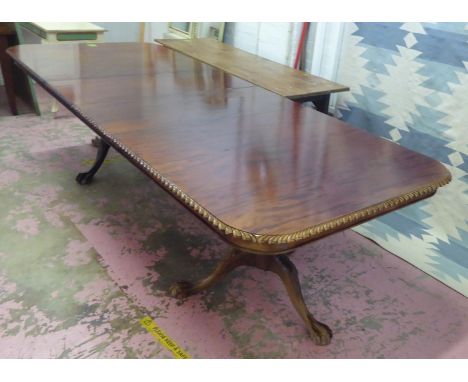 DINING TABLE, Chippendale design mahogany extending with a carved border and two extra leaves on twin leaf carved decorated p