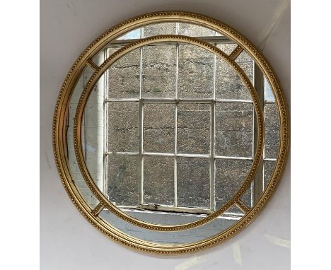 CIRCULAR WALL MIRROR, Georgian style giltwood with bead decorated frame and marginal plates, 90cm diam. 