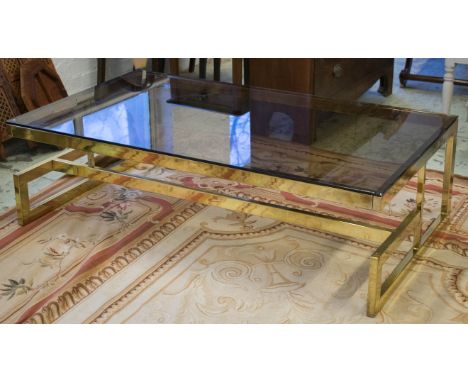 LOW TABLE, circa 1970, brass framed with rectangular tinted glass top (chip to glass), 41cm H x 140cm x 80cm. 