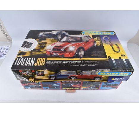 TWO BOXED SCALEXTRIC SETS, the first a Jaguar Challenger, C707, includes boxed track, two Mega Sound triggers, power and two 
