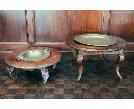 A Middle Eastern brass brazier table, teak surround, 80 cm diameter, together with another similar, 88 cm diameter.Qty: 2Prov