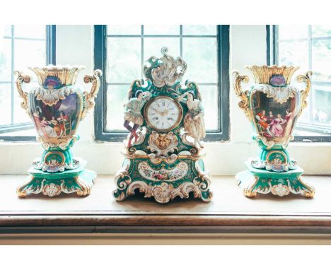 A mid-19th century French porcelain clock garniture, unmarked but probably Jacob Petite the clock with figural mounts and app