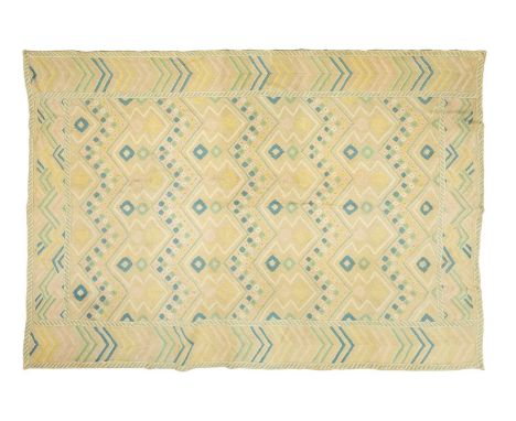 A large 'Mid-Century Vintage' style needlework rug in geometric patterns with muted tones of ochre and pastel blue. 267 cm x 