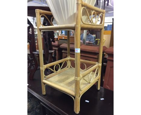 A CANE TABLE, CARVED PLANT STAND AND 2 LAMP SHADES