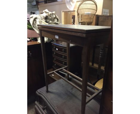 A TILT TOP CARD TABLE