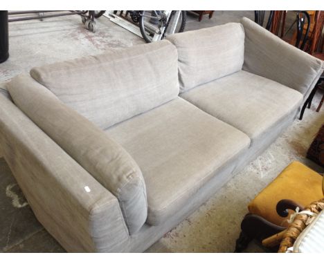 A GREY UPHOLSTERED 4 SEATER SOFA W250CM D90CM