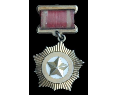 *North Korea, Hero of the DPRK, early to mid-1950’s in silver-gilt and white enamel, with screwback suspension, 37.1mm (inclu