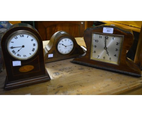 An Edwardian mahogany and inlaid mantel clock with enamelled dial and two 1930's mantel clocks
