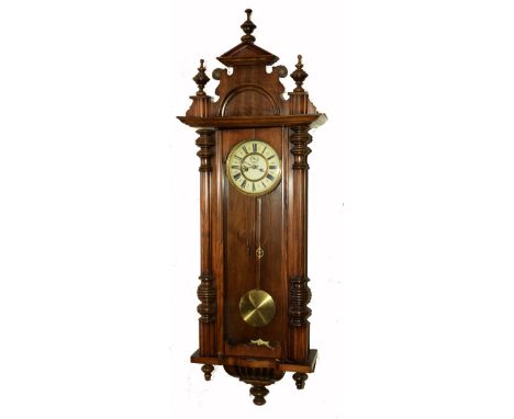 A Walnut regulator wall clock with fluted pillars