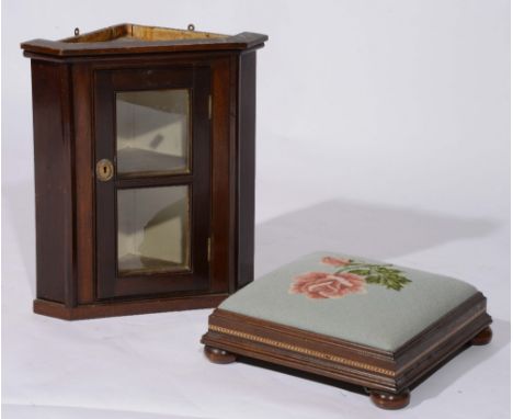 A small mahogany corner cupboard with glazed door, 42cm wide, 50cm high and an inlaid square footstool with tapestry cover (2