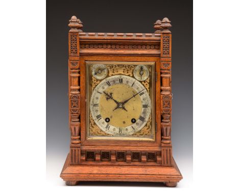 A late Victorian oak bracket clock with ting tang movement by Winterhalder & Hoffmeir, the case with carved pillar supports a