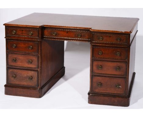 A Victorian mahogany pedestal desk the breakfront with three single drawers over six further small drawers, 75cm high, 122cm 
