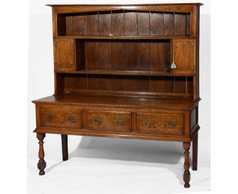 An oak dresser  with raised shelf back and fitted drawers, 165cm across