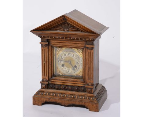 A Victorian oak cased mantel clock with striking movement and arched case, 42cm