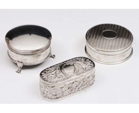 A silver trinket box of circular form with rising lid and cabriole supports, together with a further silver trinket box of ci