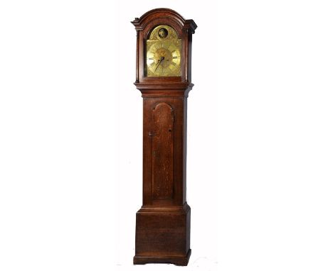 An oak longcase clock with arched brass dial with seconds dial date aperture and rocking Old Father Time, 215cm high