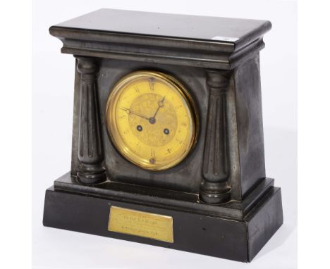 A Greek Revival black slate mantel clock with striking movement, engraved brass dial and plaque with inscription dated 1861