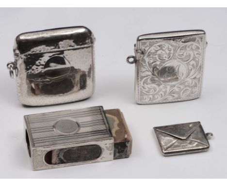 A silver stamp case in the form of an envelope, together with a silver vesta case holder with engine turned decoration and tw
