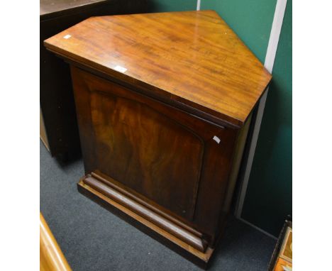 A 19th Century mahogany standing corner cupboard the door enclosing a single shelf, all on plinth base, 82cm high, 74cm wide