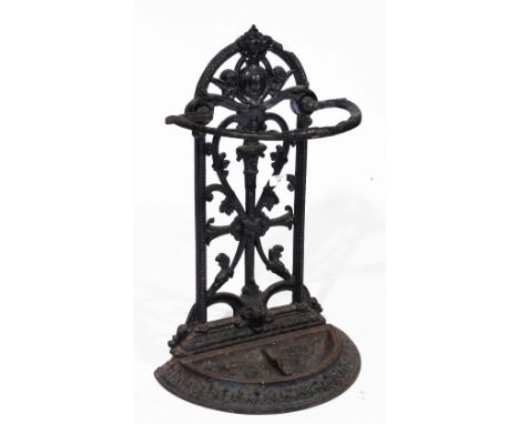 A Victorian cast iron stick stand decorated with cherubs and intertwined vines on semi circular base, 66cm high, 38cm wide