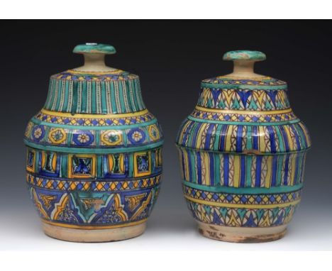 Two Moroccan polychrome ceramic butter pots or jobbana late 19th/early 20th Century, each 28cm high