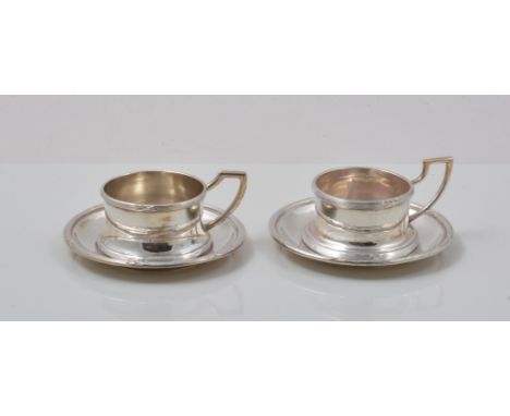 Two Austria-Hungary silver cups and saucers, reeded outlines, height 4cm.