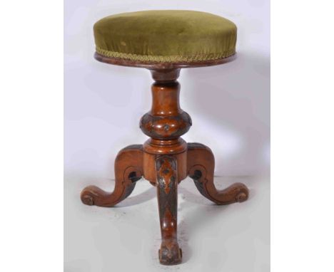 Victorian walnut adjustable piano stool, upholstered seat, carved tripod legs, diameter 32cm.