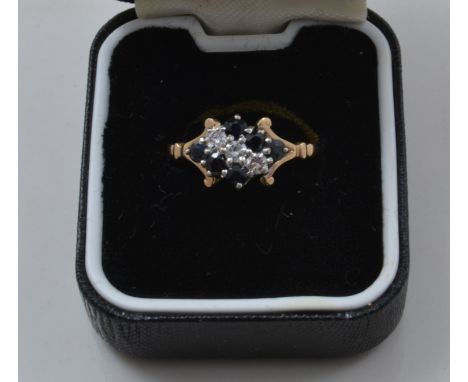 9ct diamond and sapphire ring, with six sapphires and three diamonds.